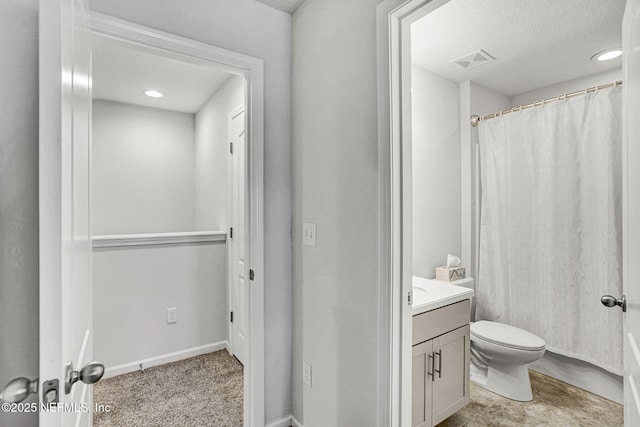 12424 Shady Bridge Trl, Jacksonville, FL 32258 - bathroom with a textured ceiling, vanity, visible vents, toilet, and baseboards