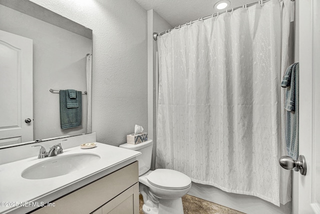 12424 Shady Bridge Trl, Jacksonville, FL 32258 - bathroom with a textured ceiling, vanity, toilet, shower / tub combo with curtain, and a textured wall