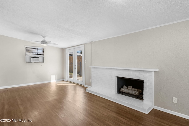 7653 Rolling Hills Dr, Jacksonville, FL 32221 - unfurnished living room with a textured ceiling, baseboards, wood finished floors, and a brick fireplace