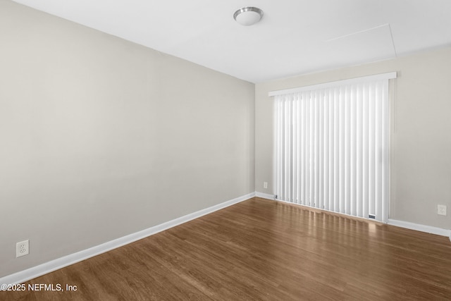 7653 Rolling Hills Dr, Jacksonville, FL 32221 - unfurnished room featuring baseboards and wood finished floors