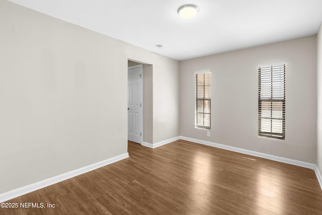 7653 Rolling Hills Dr, Jacksonville, FL 32221 - unfurnished room with dark wood-style floors and baseboards
