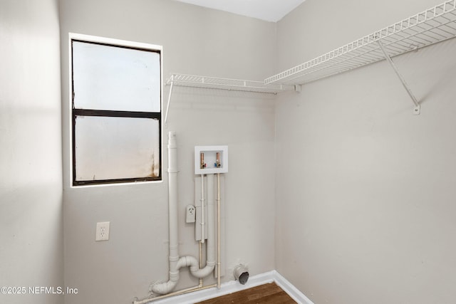 7653 Rolling Hills Dr, Jacksonville, FL 32221 - laundry room with baseboards, wood finished floors, laundry area, and hookup for a washing machine