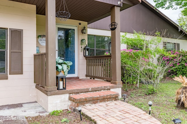 property entrance featuring covered porch