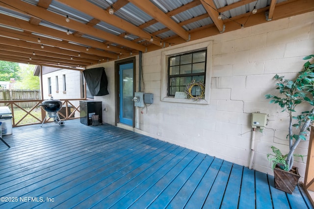 wooden terrace with fence and grilling area