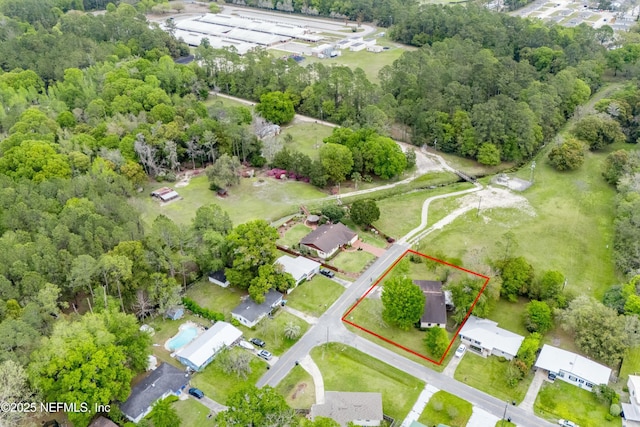 aerial view featuring a view of trees