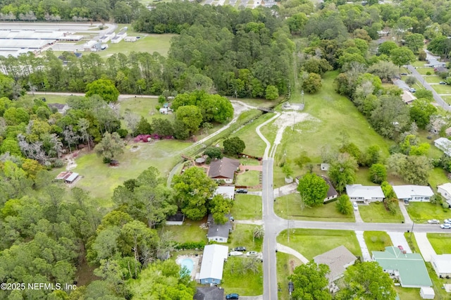 birds eye view of property with a residential view