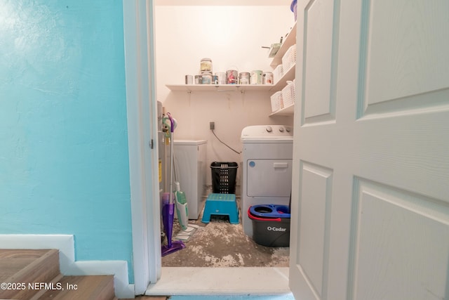 laundry room with washing machine and clothes dryer and laundry area