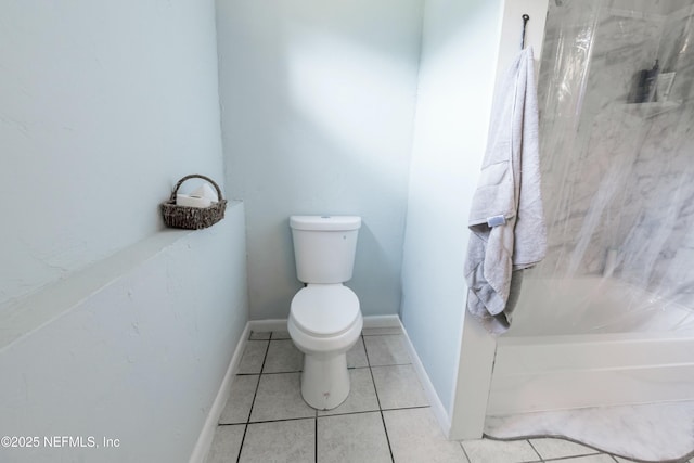 full bath featuring a bathtub, a shower, baseboards, toilet, and tile patterned flooring