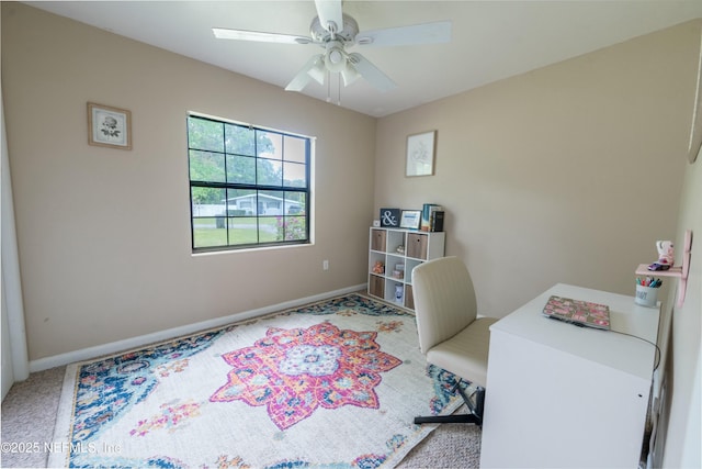 home office with baseboards and ceiling fan