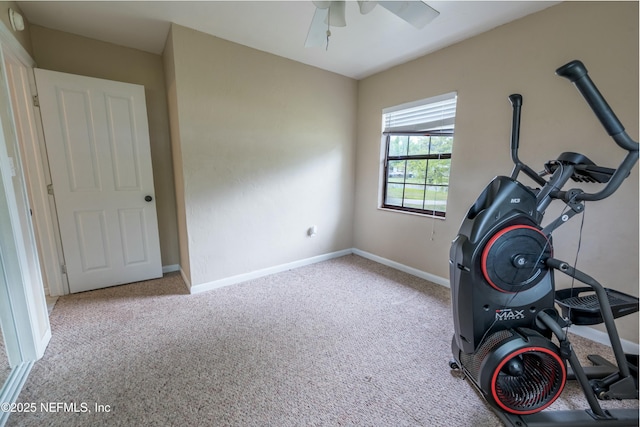 exercise room with a ceiling fan, carpet floors, and baseboards