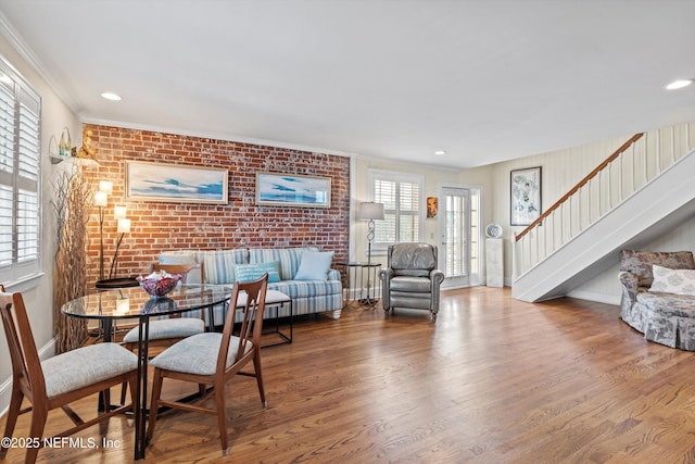 819 Lasalle St Unit 819, Jacksonville, FL 32207 - living room featuring stairs, wood finished floors, baseboards, and brick wall