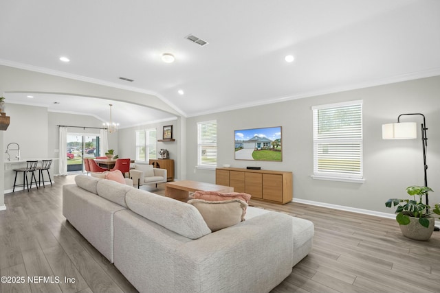 14 Balmoral Castle Dr, Saint Johns, FL 32259 - living room featuring light wood-style floors, vaulted ceiling, and crown molding