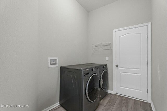 14 Balmoral Castle Dr, Saint Johns, FL 32259 - laundry area with washer and clothes dryer, laundry area, baseboards, and wood finished floors