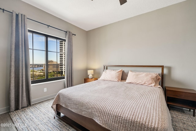 1478 Riverplace Blvd Unit 1103, Jacksonville, FL 32207 - bedroom featuring baseboards and a ceiling fan