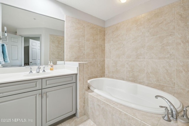 1478 Riverplace Blvd Unit 1103, Jacksonville, FL 32207 - bathroom featuring a bath, tile walls, tile patterned flooring, and vanity