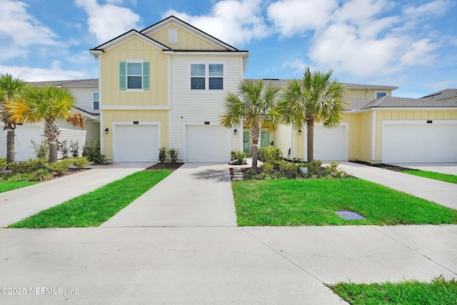 90 Ember St, Saint Augustine, FL 32092 - view of front of home with board and batten siding and concrete driveway
