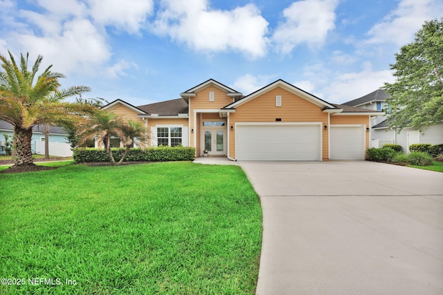 119 Cypress Banks Dr, Saint Johns, FL 32259 - view of front of house with french doors, a garage, concrete driveway, and a front lawn