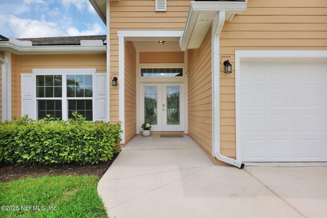 119 Cypress Banks Dr, Saint Johns, FL 32259 - view of exterior entry with french doors and a garage