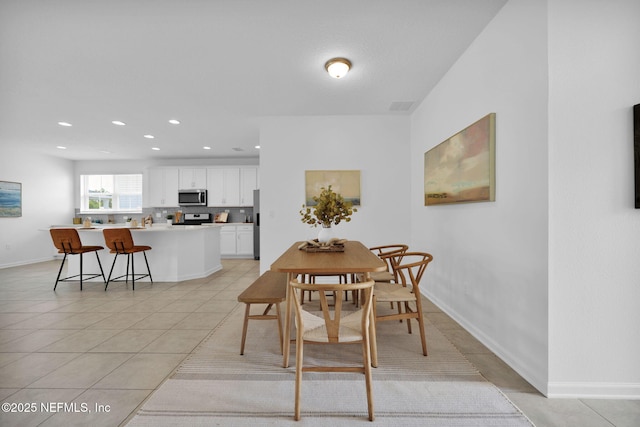 119 Cypress Banks Dr, Saint Johns, FL 32259 - dining space featuring light tile patterned floors, recessed lighting, and baseboards