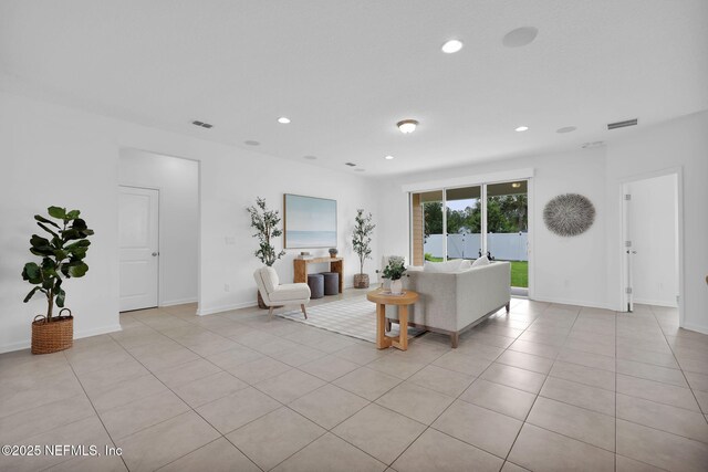 119 Cypress Banks Dr, Saint Johns, FL 32259 - living area featuring light tile patterned floors, recessed lighting, and baseboards