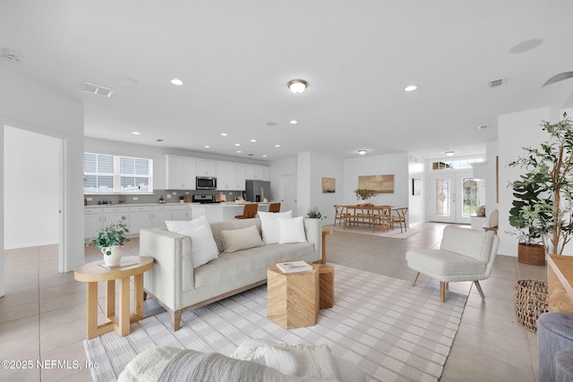 119 Cypress Banks Dr, Saint Johns, FL 32259 - living room with light tile patterned floors, plenty of natural light, and recessed lighting