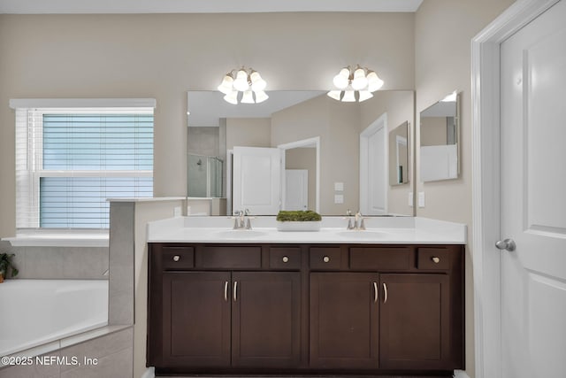 119 Cypress Banks Dr, Saint Johns, FL 32259 - full bath with a chandelier, a shower stall, double vanity, and a garden tub