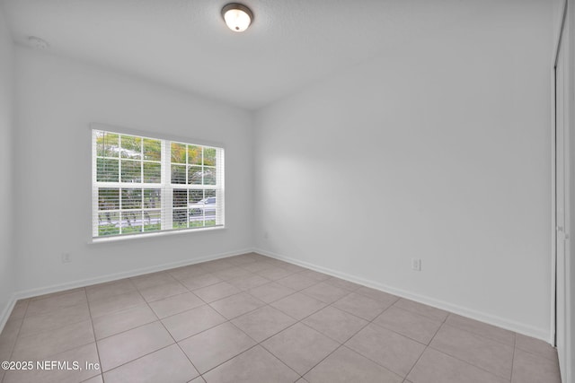 119 Cypress Banks Dr, Saint Johns, FL 32259 - spare room featuring light tile patterned floors, a smoke detector, and baseboards