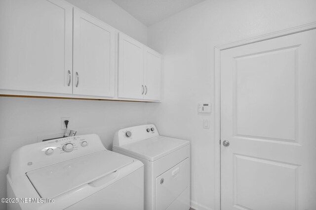 119 Cypress Banks Dr, Saint Johns, FL 32259 - laundry area with cabinet space and washer and clothes dryer