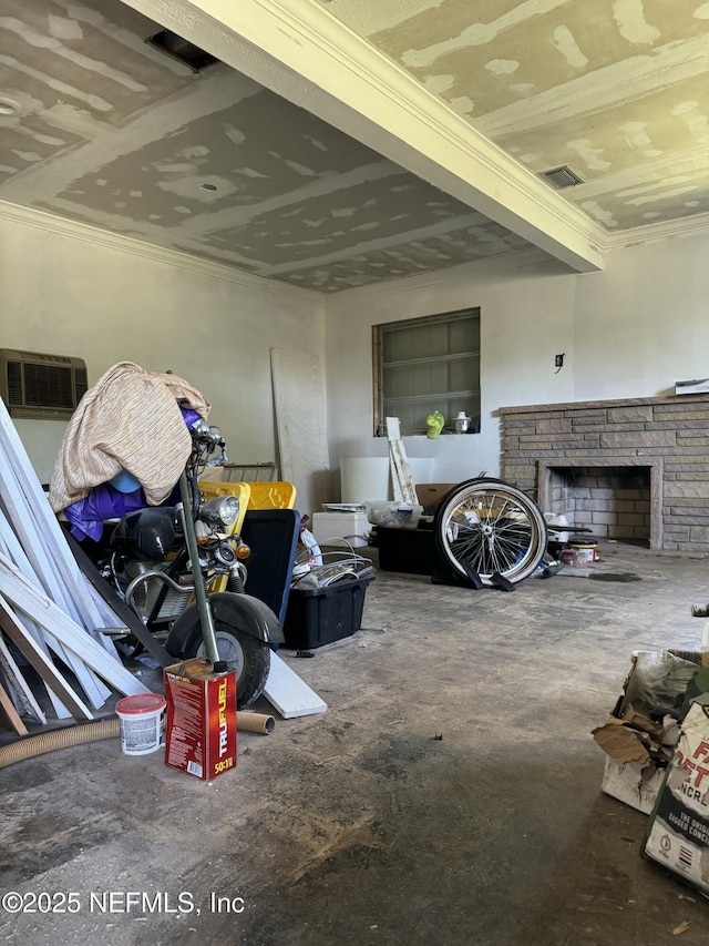 1103 Palm Cir, Jacksonville Beach, FL 32250 - interior space with a stone fireplace, ornamental molding, and unfinished concrete floors