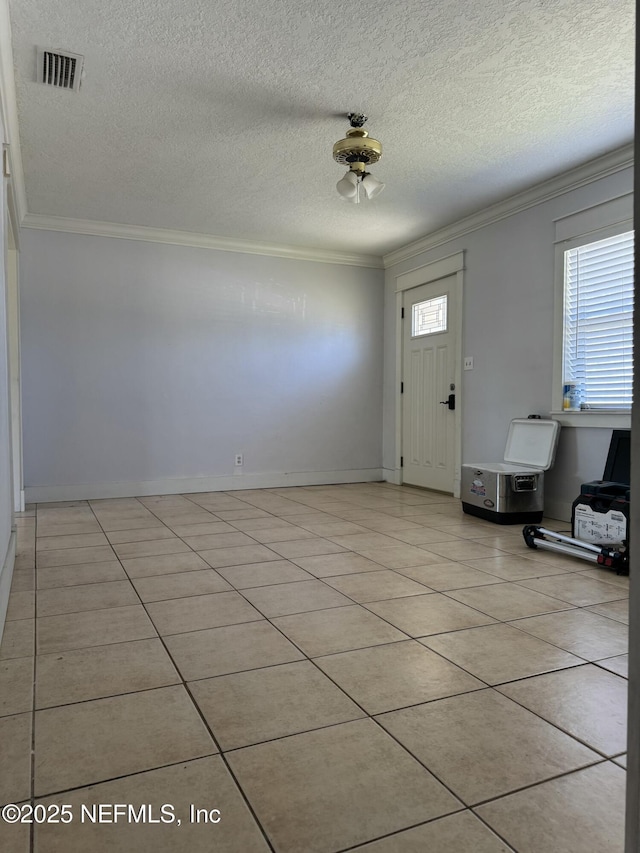 1103 Palm Cir, Jacksonville Beach, FL 32250 - foyer entrance with visible vents, crown molding, and light tile patterned floors