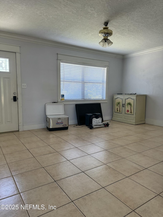 1103 Palm Cir, Jacksonville Beach, FL 32250 - entryway featuring a textured ceiling, crown molding, and light tile patterned floors