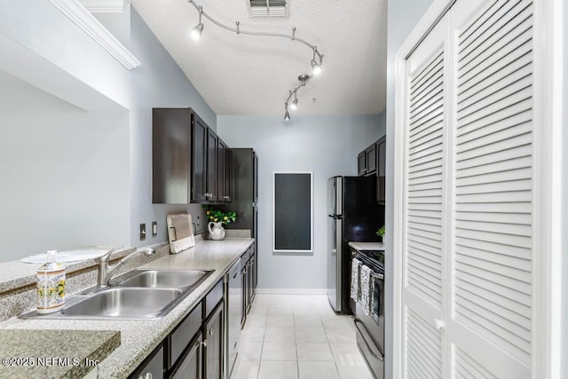 7800 Point Meadows Dr Unit 123, Jacksonville, FL 32256 - kitchen featuring light countertops, light tile patterned floors, stainless steel appliances, a sink, and visible vents