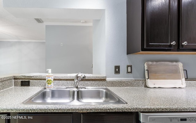 7800 Point Meadows Dr Unit 123, Jacksonville, FL 32256 - kitchen with light countertops, ornamental molding, dark brown cabinetry, a sink, and dishwashing machine