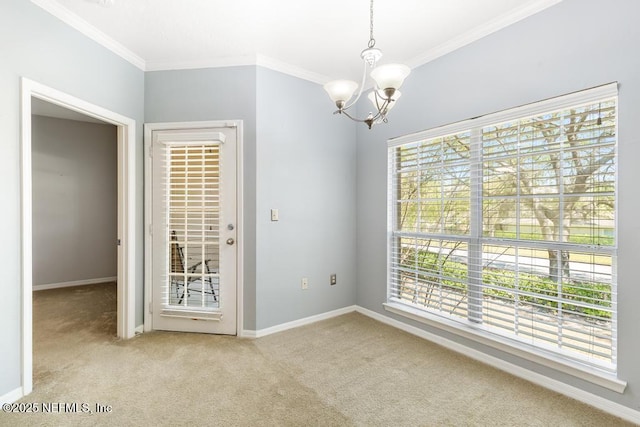 7800 Point Meadows Dr Unit 123, Jacksonville, FL 32256 - spare room with baseboards, carpet flooring, an inviting chandelier, and crown molding