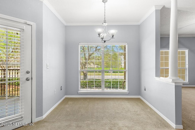 7800 Point Meadows Dr Unit 123, Jacksonville, FL 32256 - unfurnished dining area featuring an inviting chandelier, carpet floors, crown molding, and baseboards
