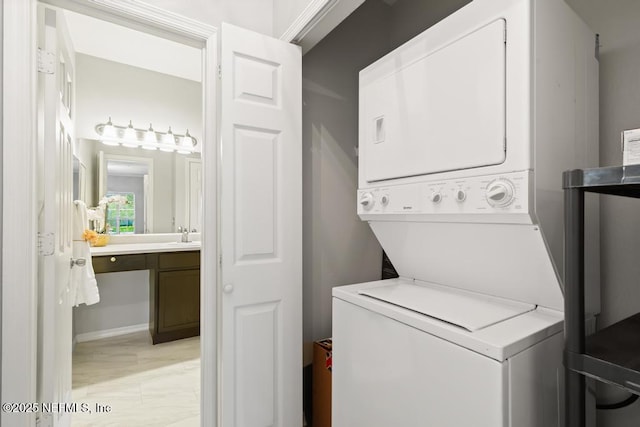 7800 Point Meadows Dr Unit 123, Jacksonville, FL 32256 - clothes washing area featuring laundry area and stacked washer / drying machine