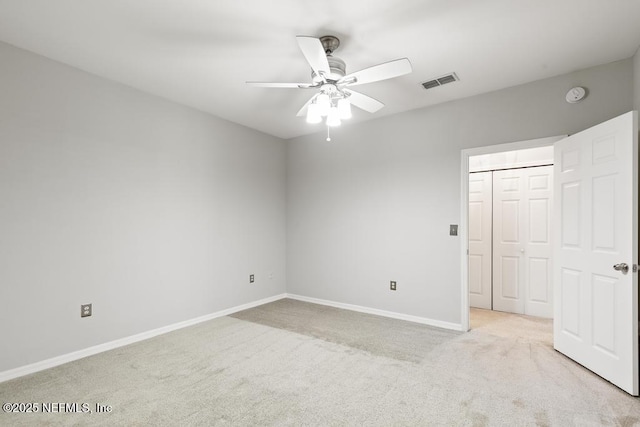 7800 Point Meadows Dr Unit 123, Jacksonville, FL 32256 - unfurnished bedroom featuring baseboards, ceiling fan, visible vents, and light colored carpet