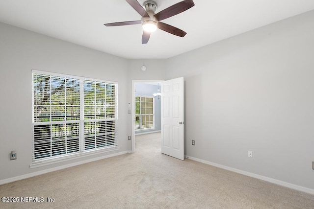 7800 Point Meadows Dr Unit 123, Jacksonville, FL 32256 - unfurnished room with baseboards, ceiling fan, and light carpet