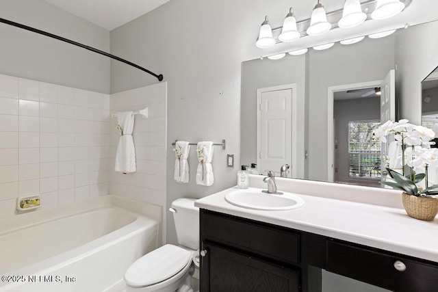 7800 Point Meadows Dr Unit 123, Jacksonville, FL 32256 - bathroom featuring toilet, vanity, and washtub / shower combination
