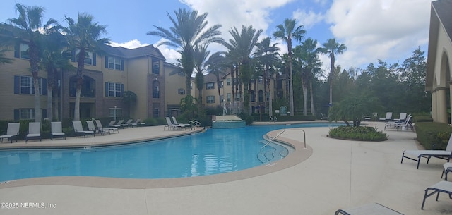 7800 Point Meadows Dr Unit 123, Jacksonville, FL 32256 - community pool featuring a patio area