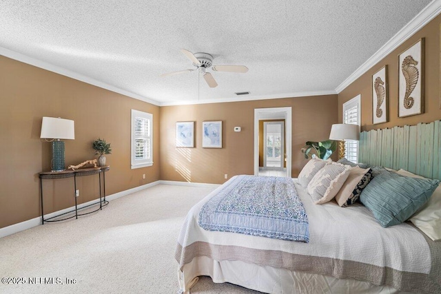 bedroom featuring a ceiling fan, crown molding, carpet flooring, and a textured ceiling
