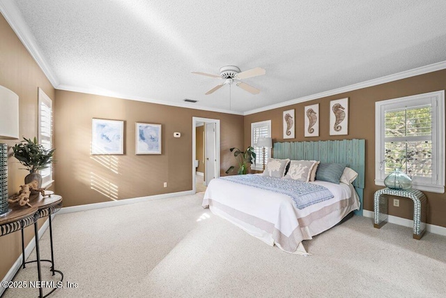 bedroom featuring visible vents, crown molding, carpet floors, and a textured ceiling