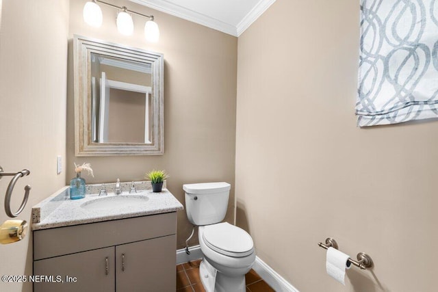half bathroom with baseboards, ornamental molding, toilet, tile patterned floors, and vanity