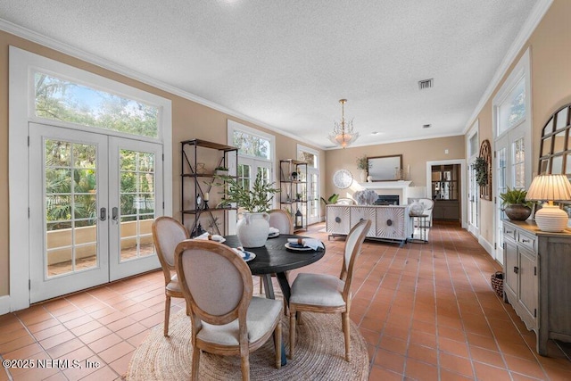 dining room with an inviting chandelier, tile patterned flooring, french doors, and visible vents
