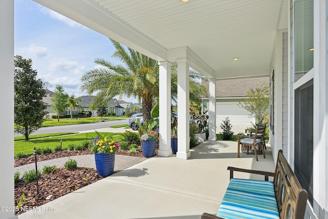 view of patio / terrace with covered porch and a residential view