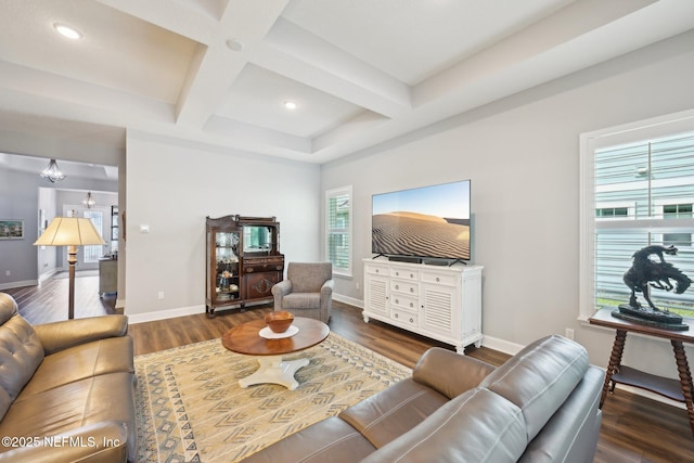 living room featuring baseboards, coffered ceiling, and wood finished floors