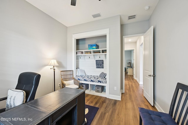 office area featuring visible vents, ceiling fan, wood finished floors, and baseboards