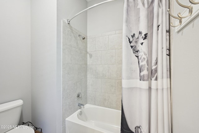 bathroom featuring toilet and shower / bath combination with curtain