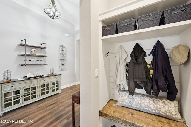 mudroom with baseboards and wood finished floors