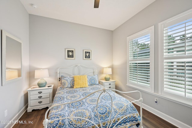 bedroom featuring baseboards, ceiling fan, and wood finished floors
